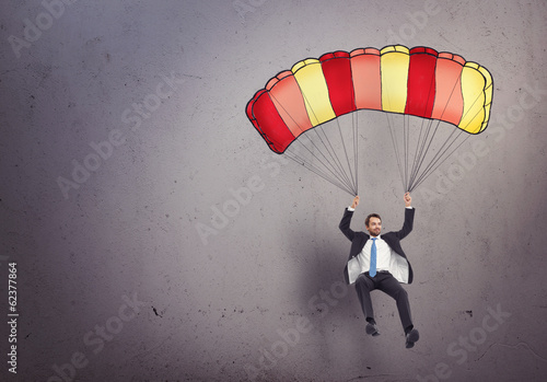 businessman with parachute photo