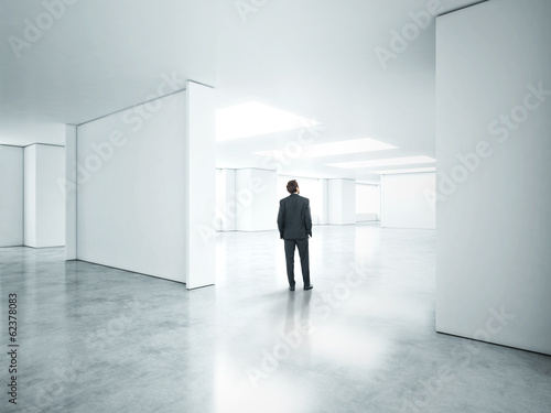 businessman standing in bright office