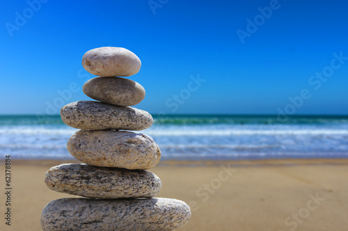 zen balance stone on the beach 3