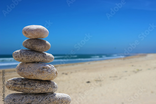 zen balance stone on the beach 7