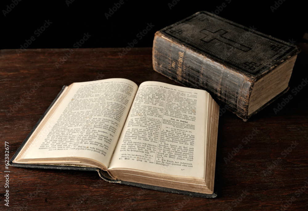 Fototapeta premium Old Bible on wooden table.