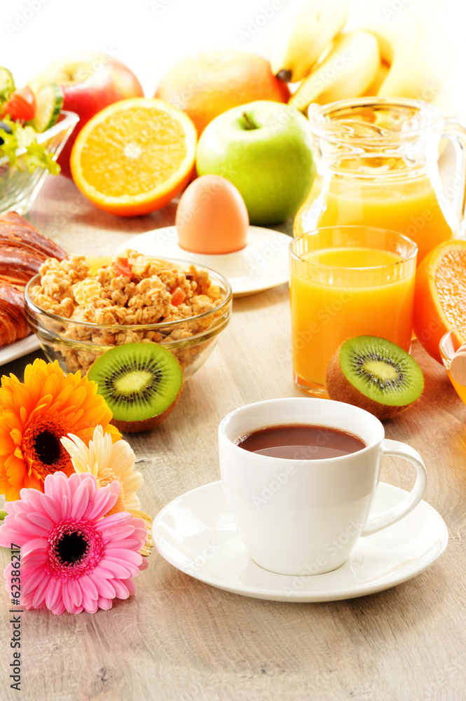 Breakfast with coffee, juice, croissant, salad, muesli and egg Breakfast with coffee, juice, croissant, salad, muesli and egg