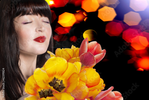 Beauty Woman brunette with Spring Flower bouquet tulips