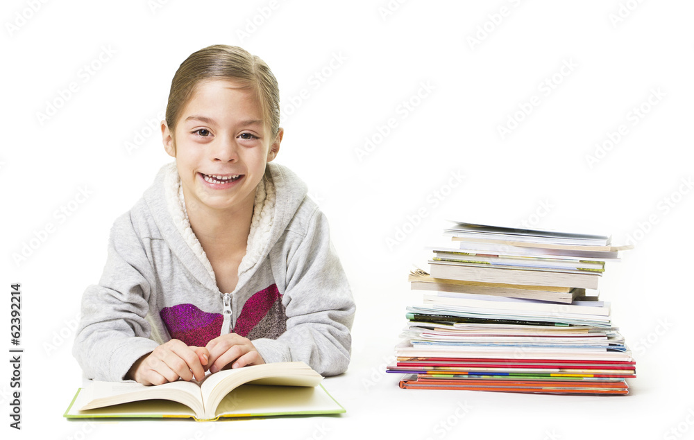 School Girl smiling while reading books School Girl smiling while reading books