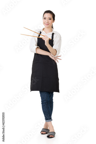 Young Asian housewife hold a chopsticks