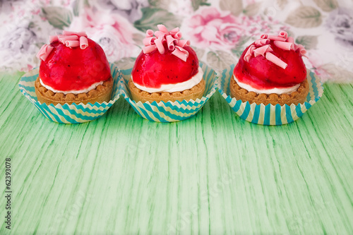 Mini tarts with cream filling and berry glaze