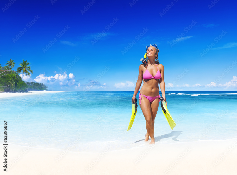 Smilig Woman with Scuba Gear on a Tropical Beach