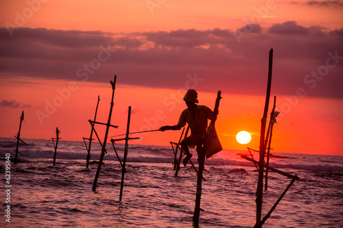 sri lankan traditional fisherman on stick photo