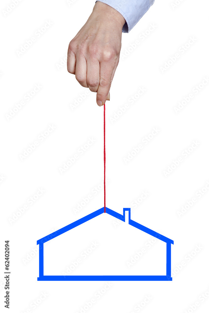 Hand holding house on the cord Hand holding house on the cord