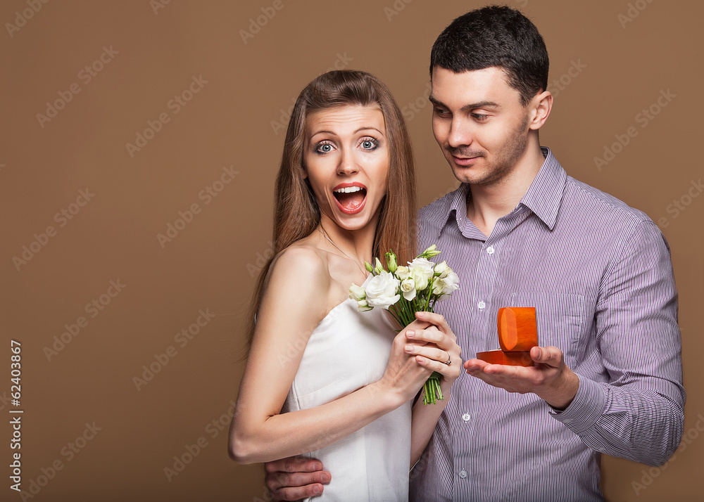 couple in love with wedding ring and gift box couple in love with wedding ring and gift box