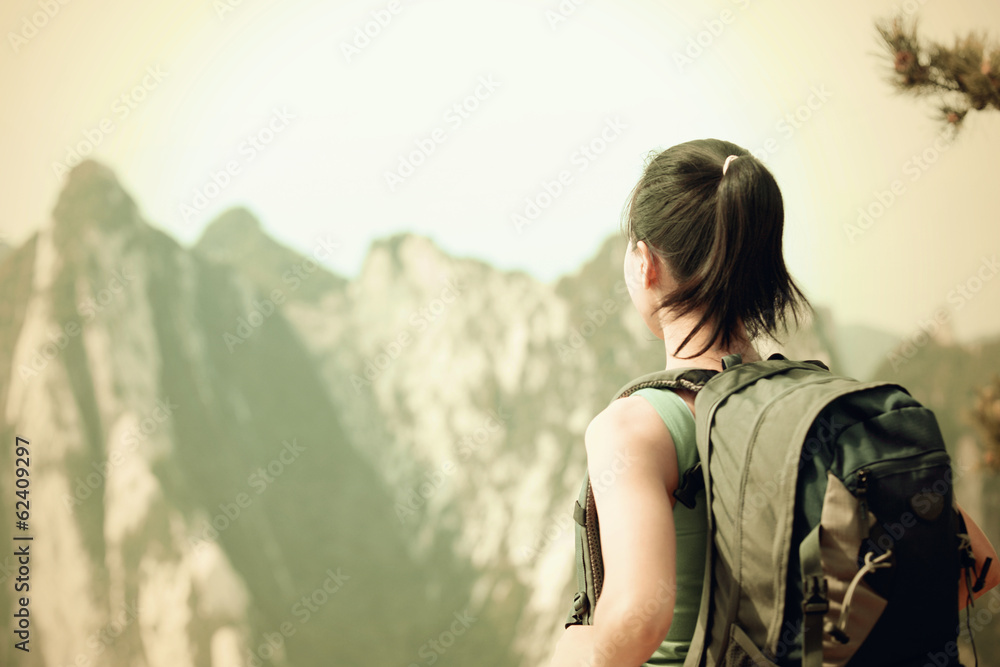 woman hiker stand at peak of mountain huashan