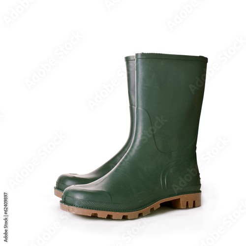 Green ruber boots on white background