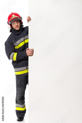 Fireman holding big blank banner