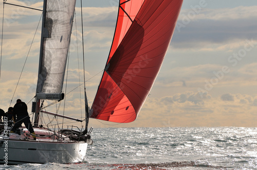 red sail at sunset