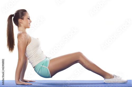 pretty young woman doing stretching exercise