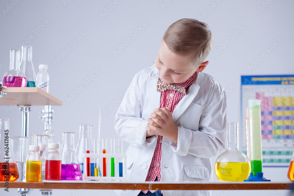 Image of little scientist posing with reagents Image of little scientist posing with reagents