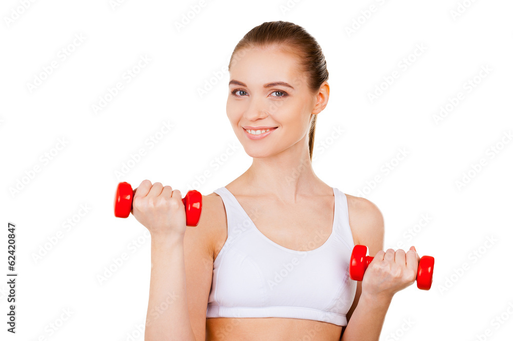 Woman exercising with dumbbells. Woman exercising with dumbbells.