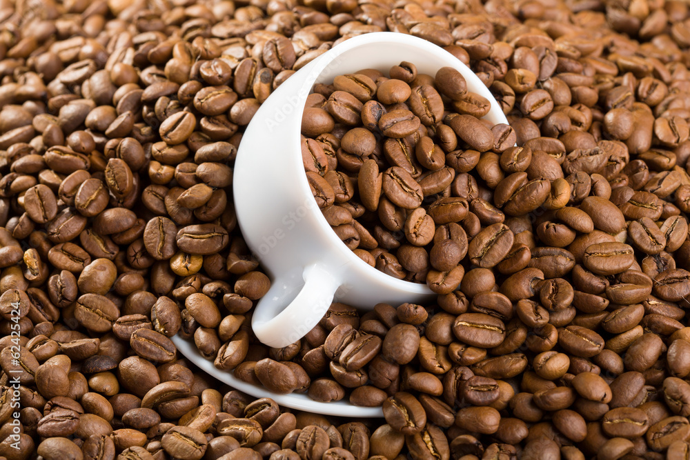 Cup with coffee beans Cup with coffee beans