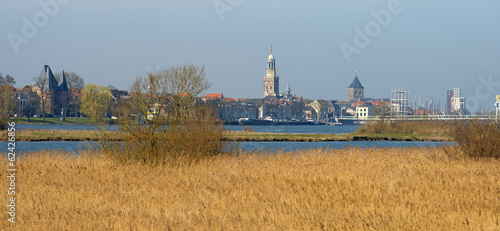 Skyline of an ancient city along a river photo