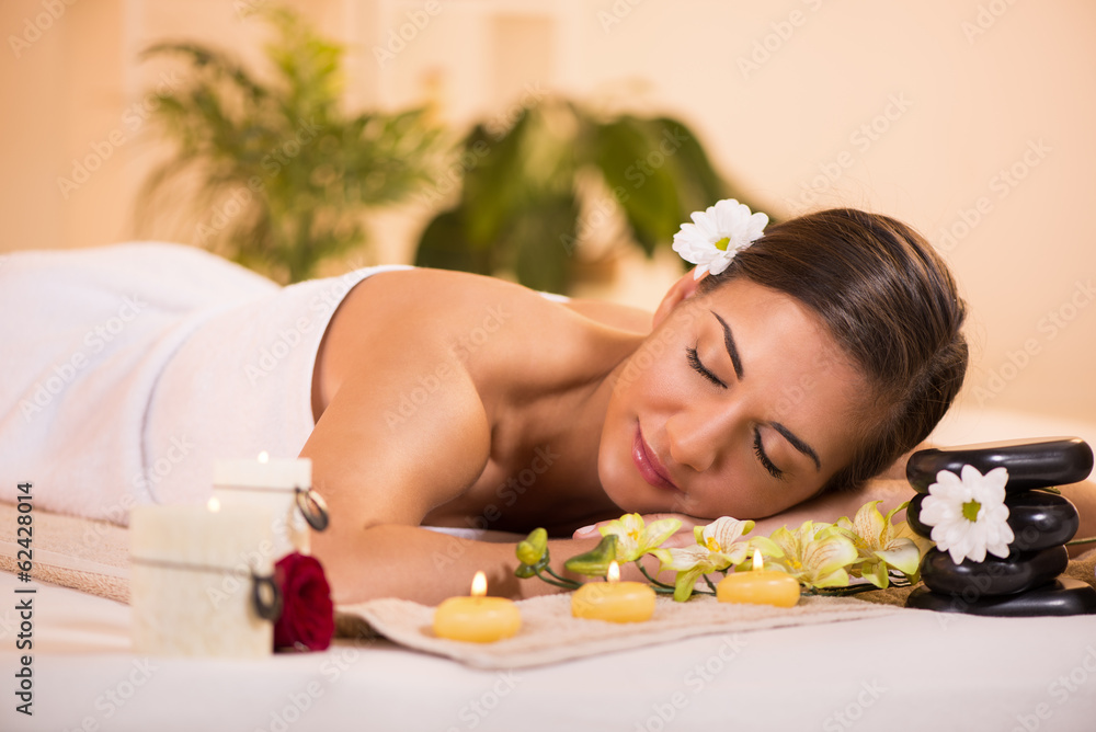 Naklejka premium Young woman enjoying in spa salon