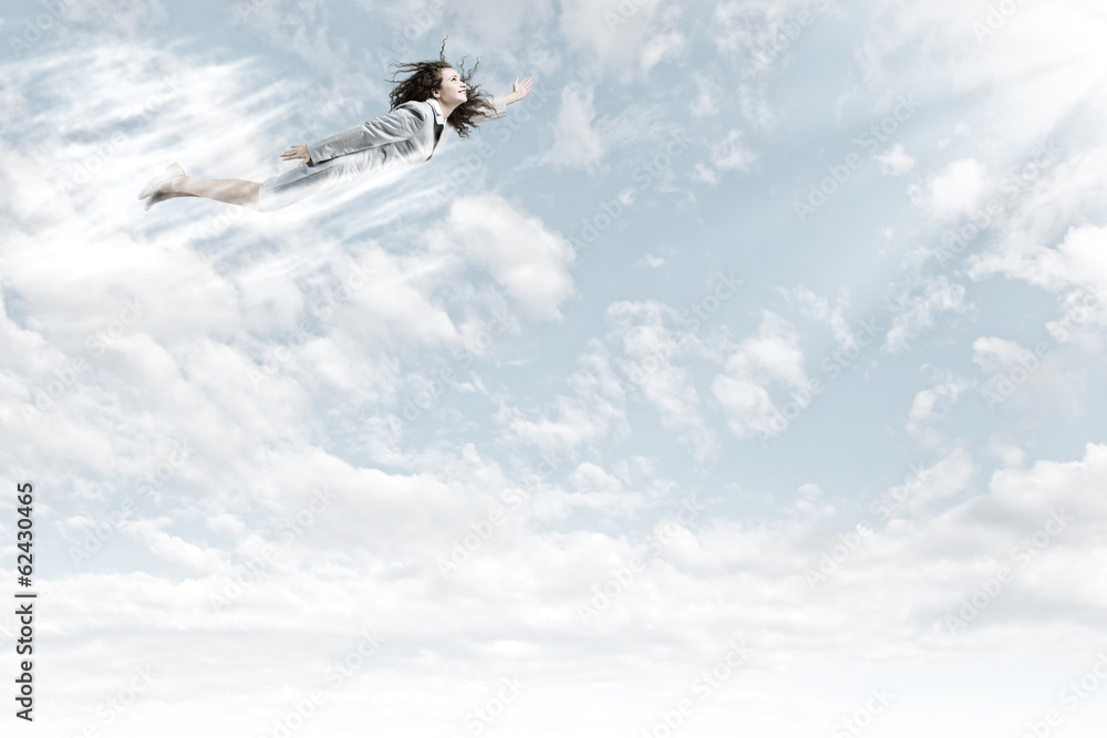 Fototapeta premium Flying businesswoman
