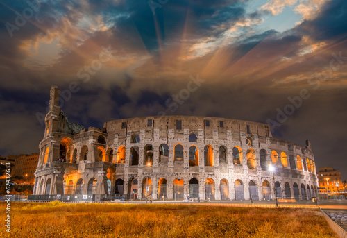 Beautiful sunset sky colors over Colosseum in Rome. Roma - Colos