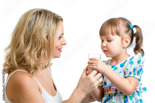 mother giving milk drink to kid