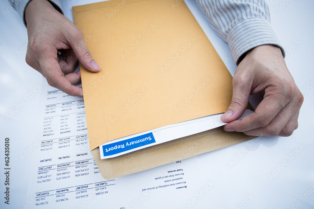 man hand with pen and business report
