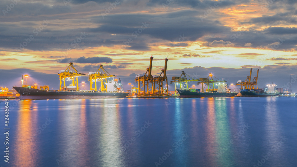 Fototapeta premium Container Cargo freight ship with working crane bridge in shipya