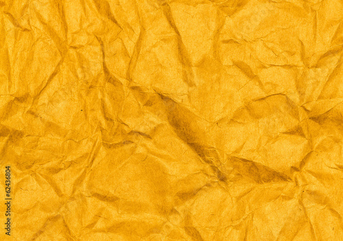 Crumpled yellow paper texture background. Craft paper sheet, viv