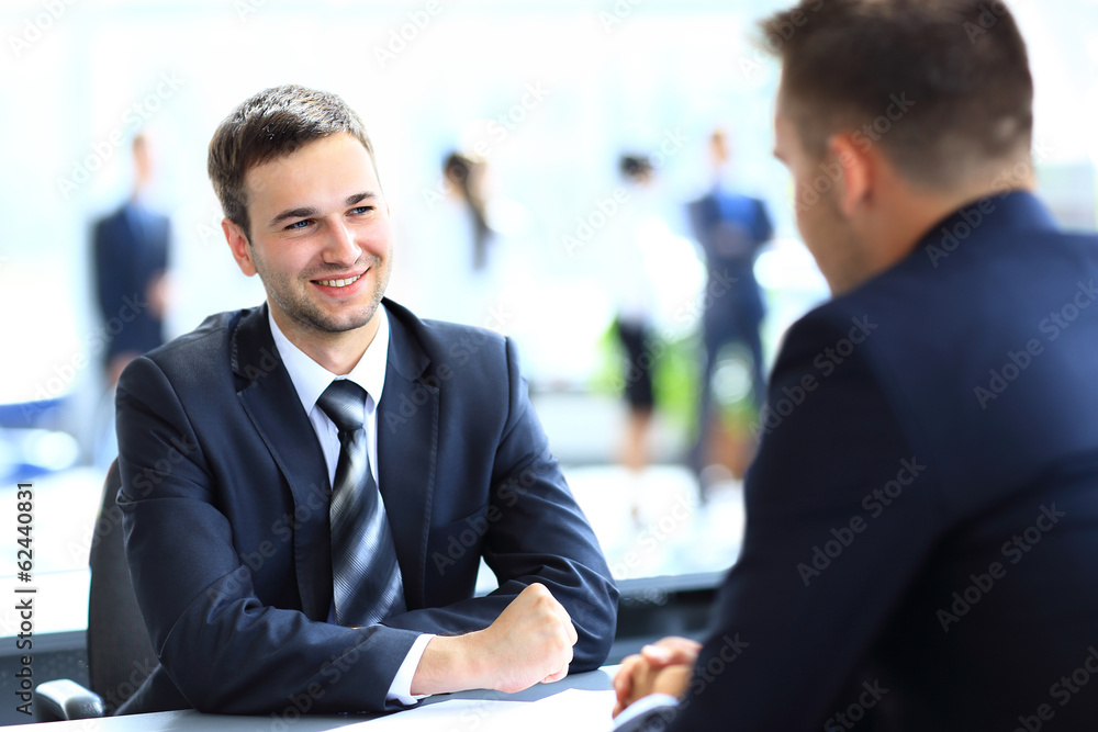 Happy business people talking on meeting at office Happy business people talking on meeting at office