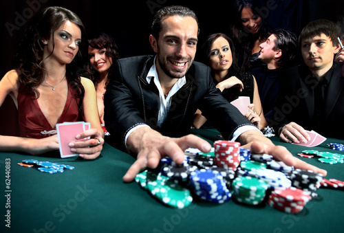 Quadro su tela Poker player going all in pushing his chips forward