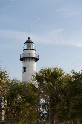 White Lighthouse Behind Palm Trees