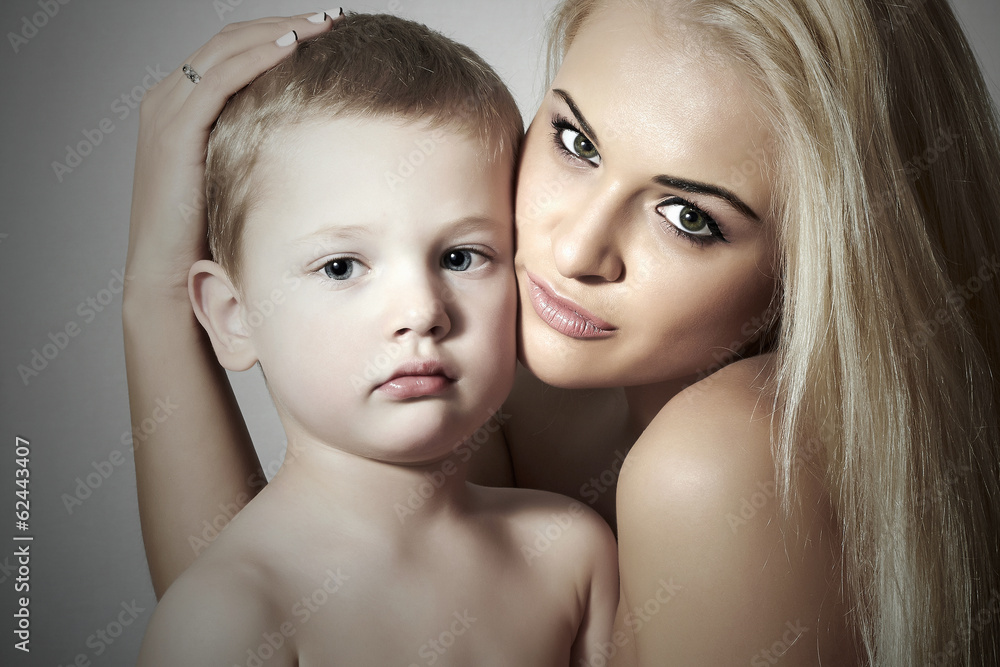 Young Mother Hugging Child.Blond Woman with Little Son.Family Young Mother Hugging Child.Blond Woman with Little Son.Family