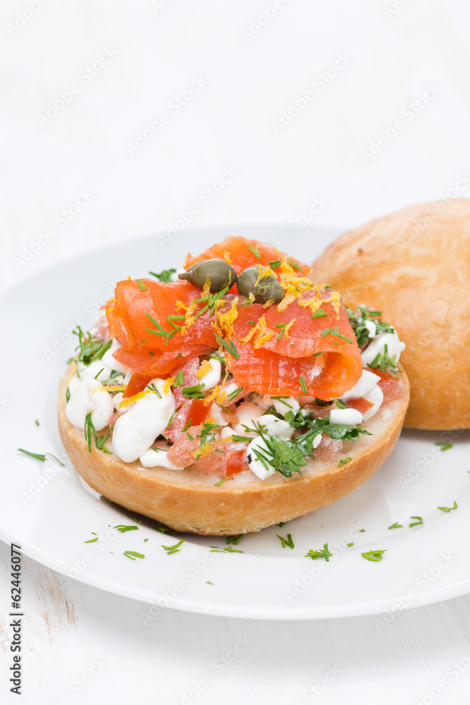 sandwich with cheese, tomato and salmon on the plate, vertical sandwich with cheese, tomato and salmon on the plate, vertical