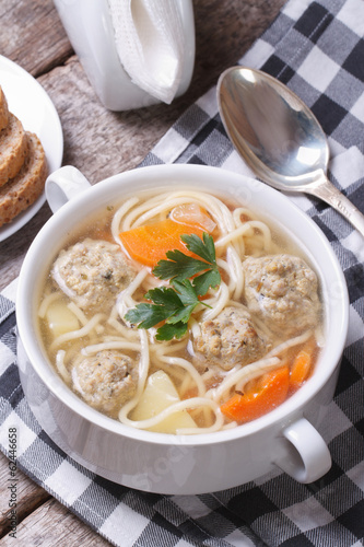 Soup with meatballs, noodles, potatoes vertical