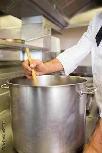 Male chef preparing food in kitchen