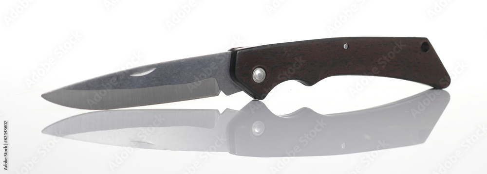 Obraz premium Pocket Knife on Glossy Floor White background