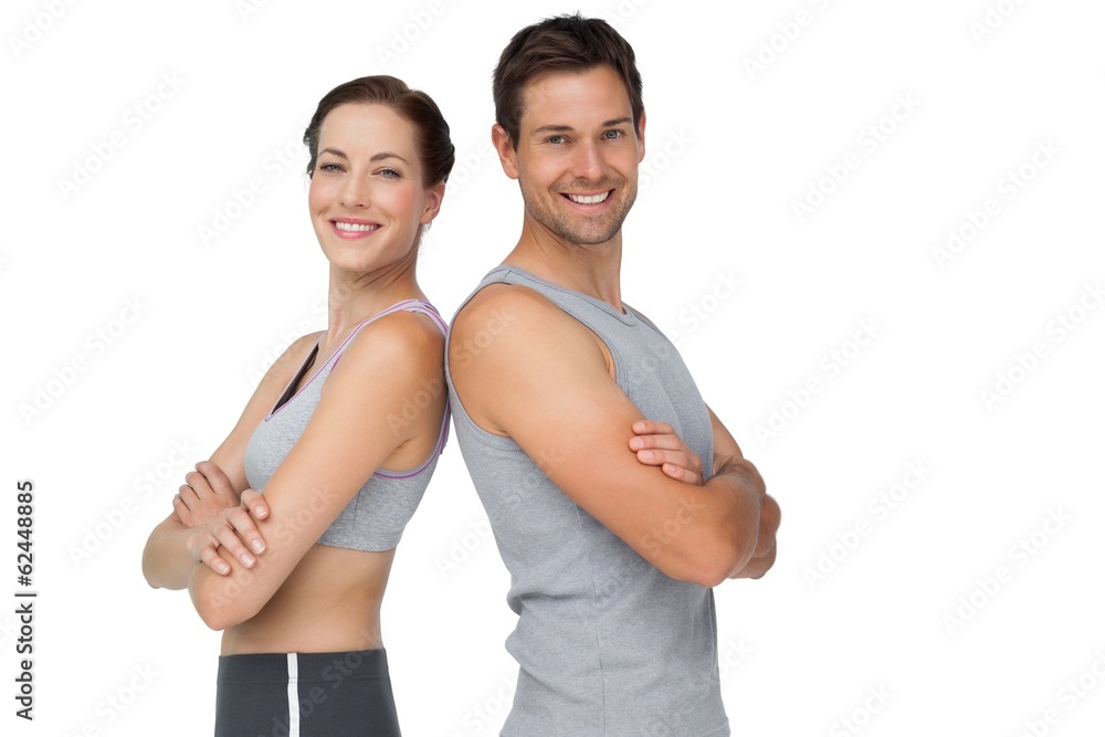 Portrait of a happy fit young couple with hands crossed Portrait of a happy fit young couple with hands crossed