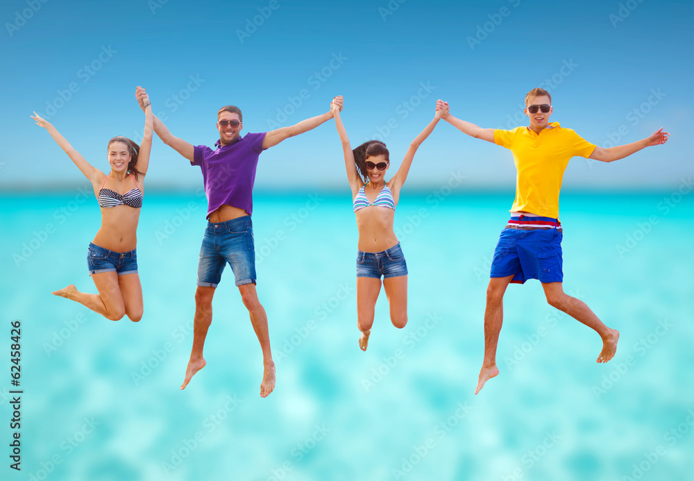 group of friends or couples jumping on the beach group of friends or couples jumping on the beach
