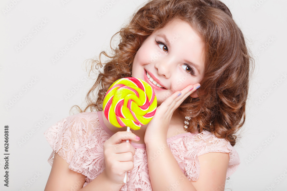 Funny child eat candy lollipop Funny baby girl eating sweets