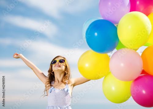 happy girl with colorful balloons