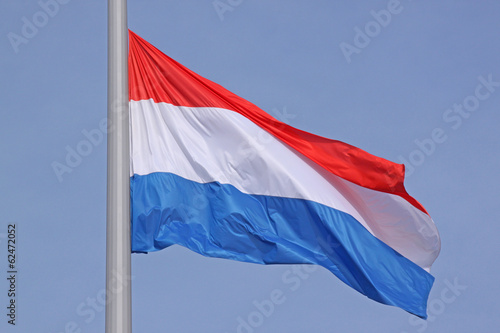 flag of Luxembourg over blue sky