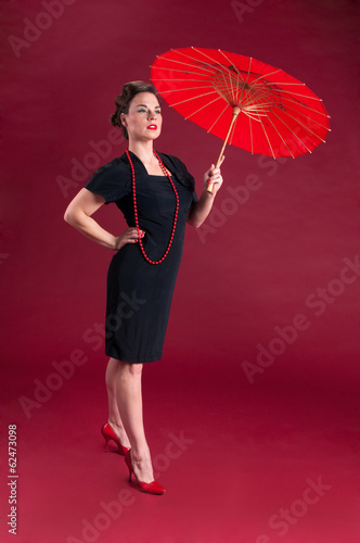 Pinup Girl in Black Dress Haughty with Red Parasol