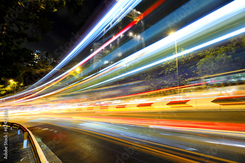 Canvas Print Fast moving car light on road at night