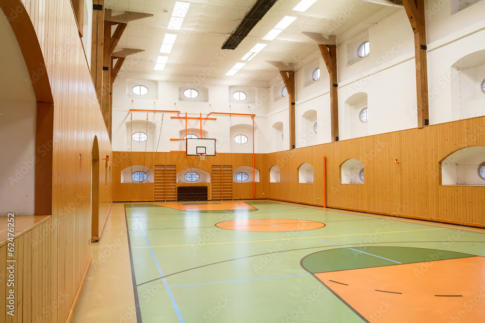 Naklejka premium Empty interior of public gym with basketball court