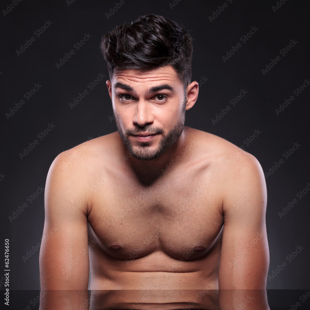 naked young man with raised eyebrows naked young man with raised eyebrows