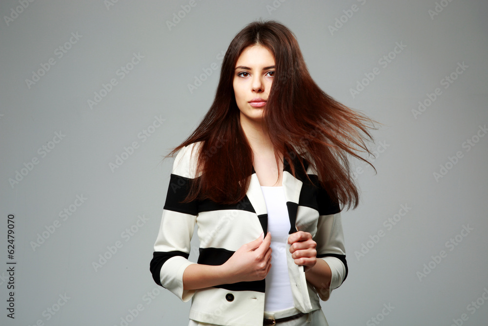 beautiful woman in casual clothes on gray background beautiful woman in casual clothes on gray background