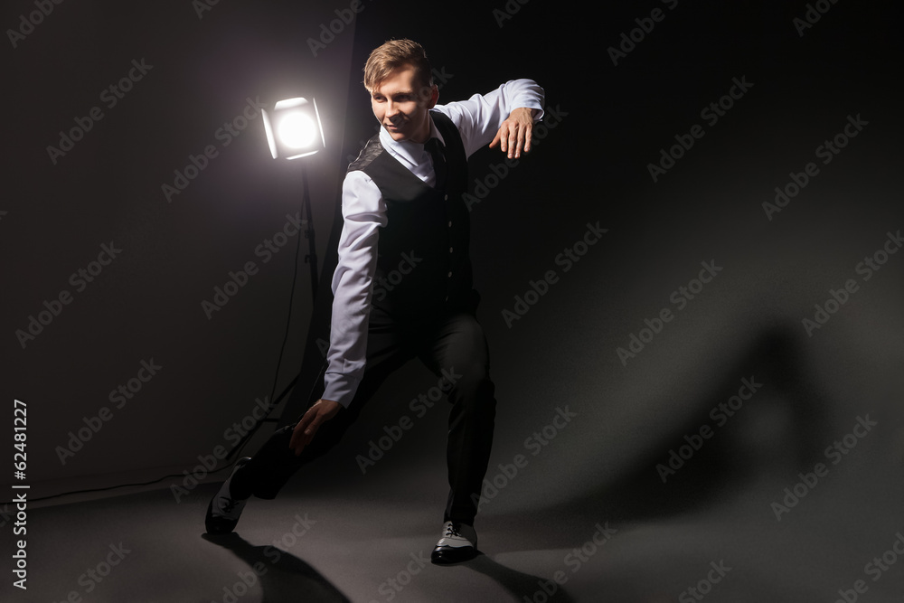 modern style dancer dancing on dark background modern style dancer dancing on dark background