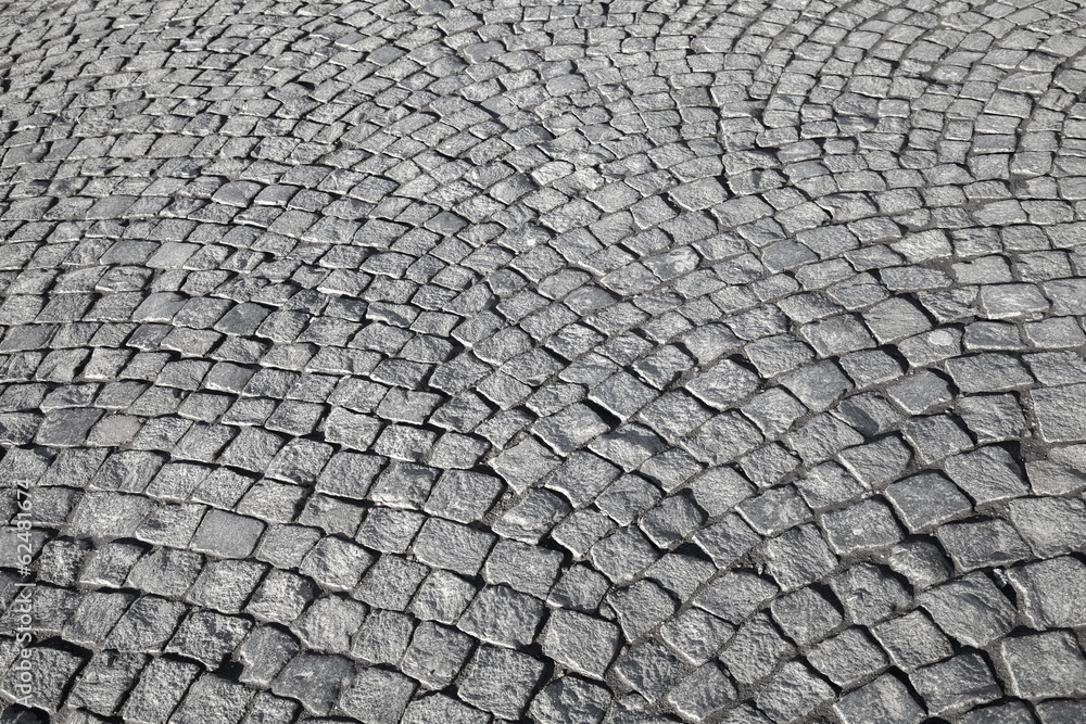 Gray granite stone pavement. Detailed background texture Gray granite stone pavement. Detailed background texture